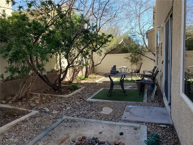 view of yard featuring a patio area and a fenced backyard