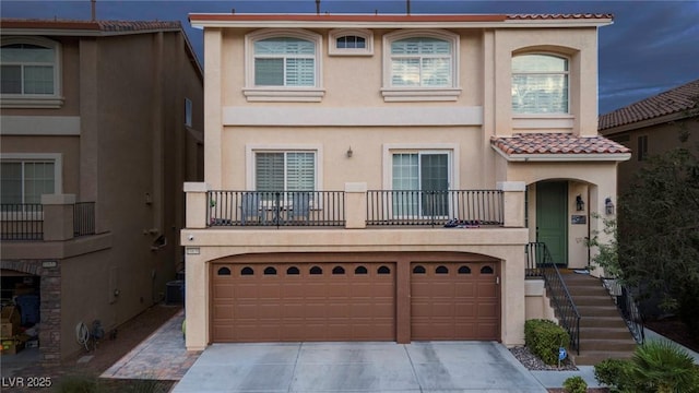 view of front of house with a balcony and a garage