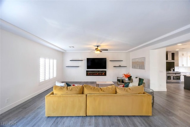 living room featuring dark hardwood / wood-style floors and ceiling fan