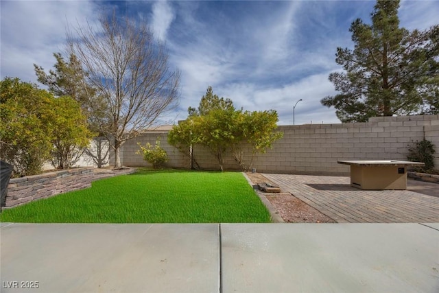 view of yard with a fire pit and a patio area