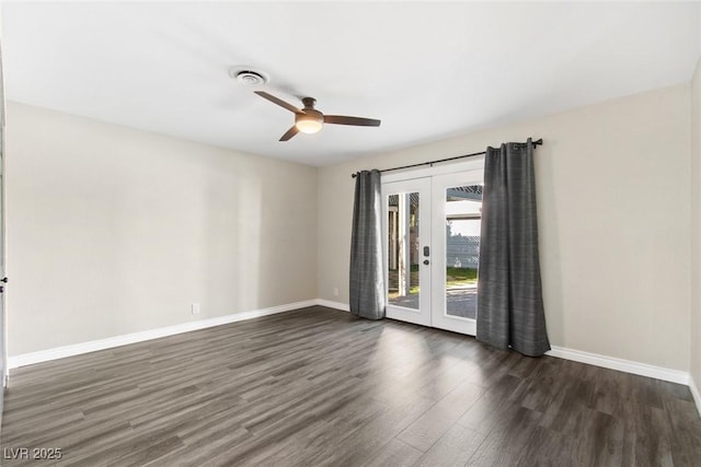 spare room with dark wood-type flooring, french doors, and ceiling fan