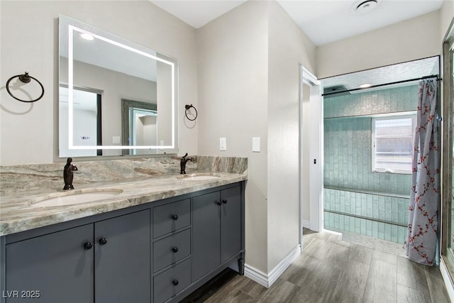 bathroom with vanity and hardwood / wood-style floors