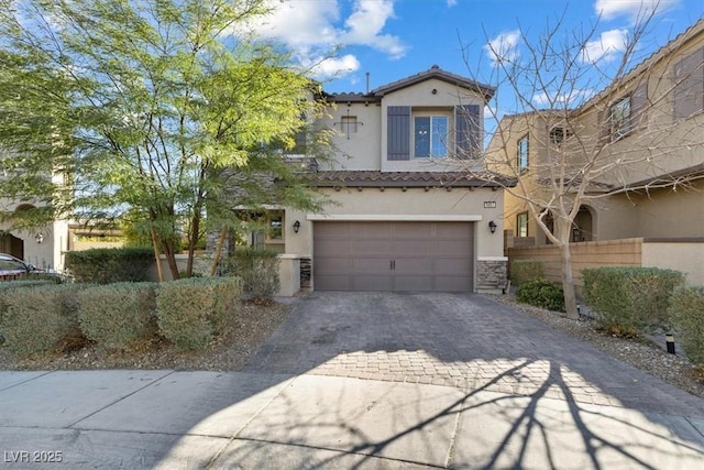 mediterranean / spanish-style house featuring a garage