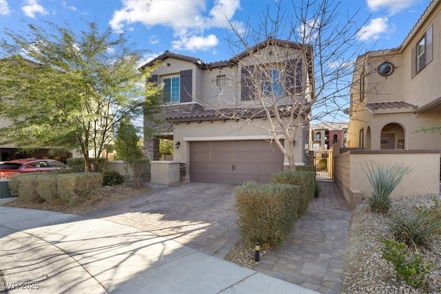 mediterranean / spanish-style home featuring a garage