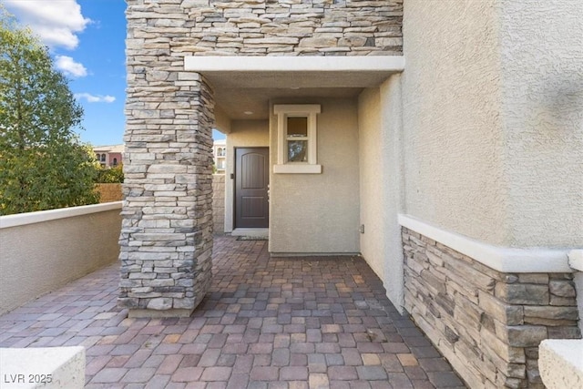 doorway to property featuring a balcony