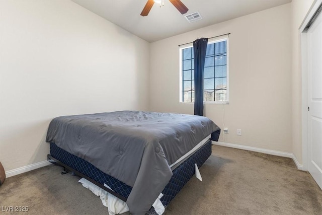 bedroom featuring ceiling fan and carpet