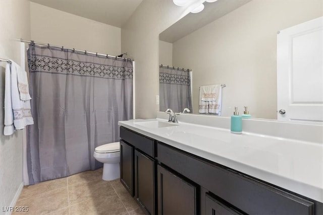 bathroom with vanity, toilet, and tile patterned flooring