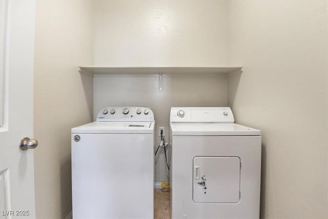 laundry area with separate washer and dryer