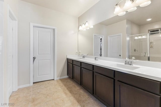 bathroom featuring vanity, tile patterned flooring, a chandelier, and walk in shower