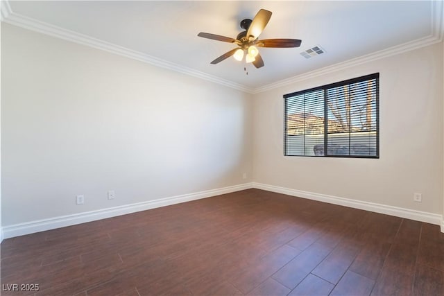 empty room featuring ornamental molding, dark hardwood / wood-style floors, and ceiling fan