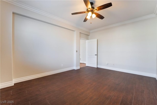 spare room with ornamental molding, dark wood-type flooring, and ceiling fan