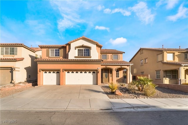 mediterranean / spanish house featuring a garage