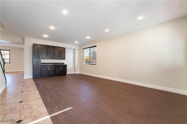 unfurnished living room with hardwood / wood-style flooring