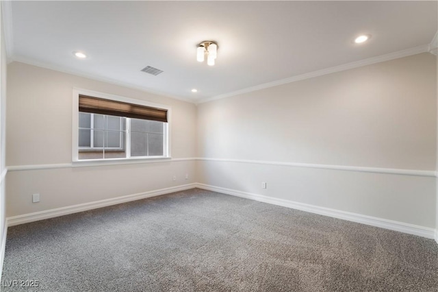 empty room with crown molding and carpet