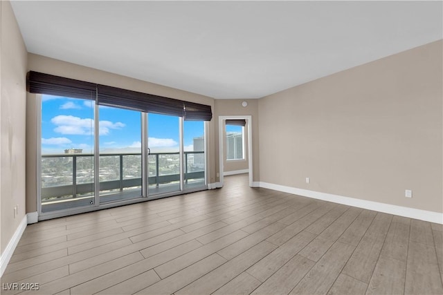 spare room with light hardwood / wood-style flooring