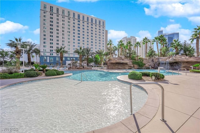 view of swimming pool with a patio area