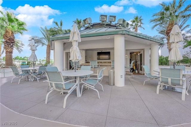 view of patio / terrace featuring a gazebo, area for grilling, and an outdoor bar