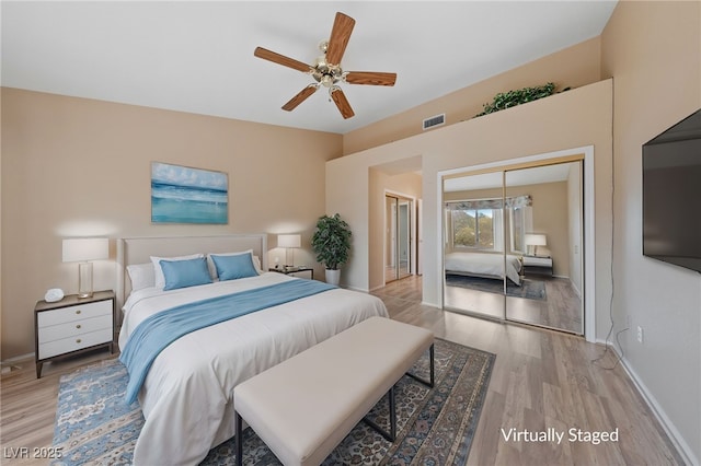 bedroom featuring a closet, ceiling fan, and light wood-type flooring