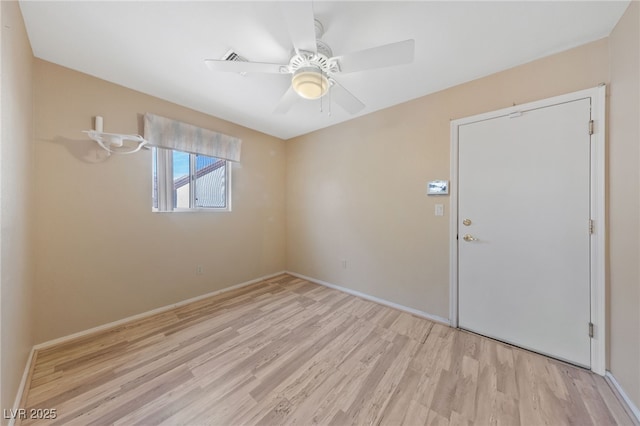 unfurnished room featuring ceiling fan and light wood-type flooring