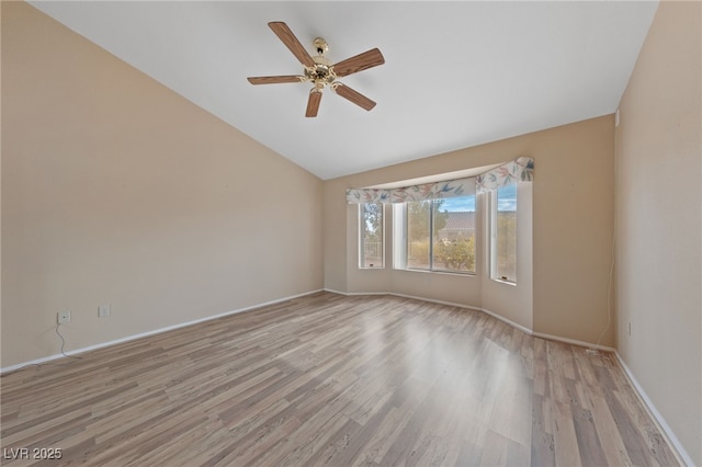 unfurnished room featuring ceiling fan, lofted ceiling, and light hardwood / wood-style flooring