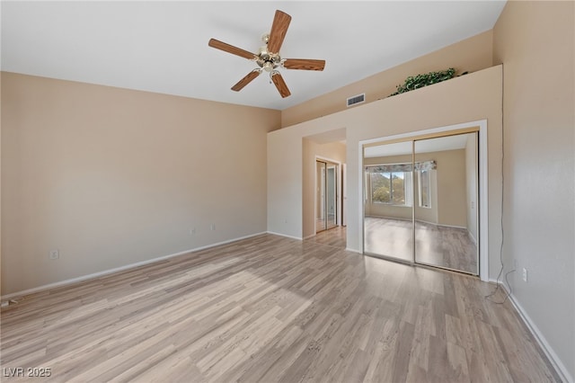 empty room featuring ceiling fan and light hardwood / wood-style flooring