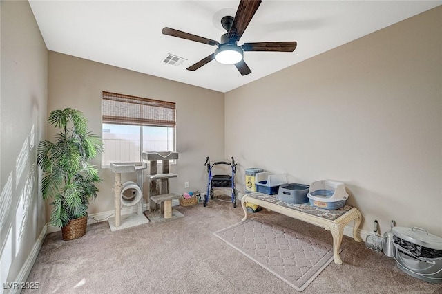 miscellaneous room featuring carpet flooring and ceiling fan