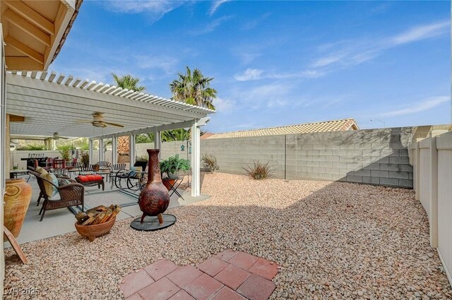 view of yard with a pergola, a patio area, and ceiling fan