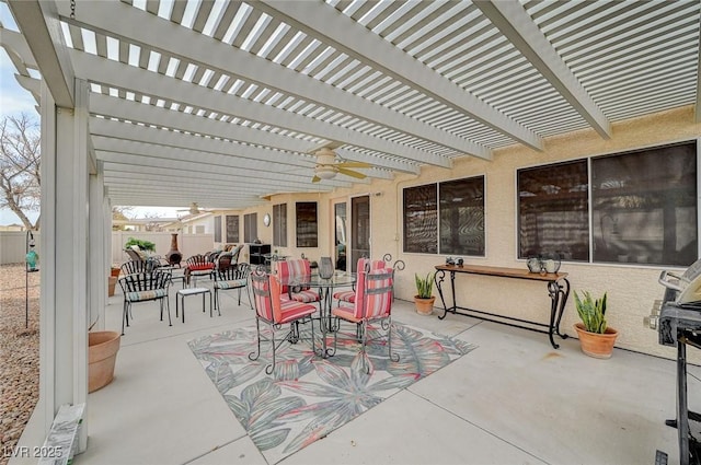 view of patio featuring a pergola and ceiling fan