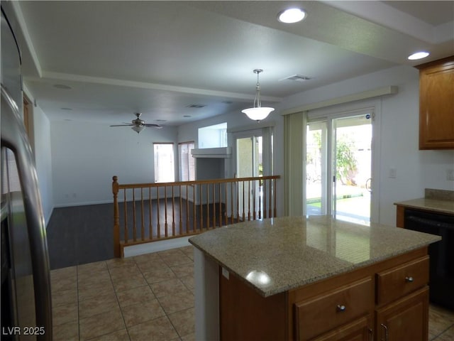 kitchen with pendant lighting, dishwasher, a kitchen island, and a wealth of natural light