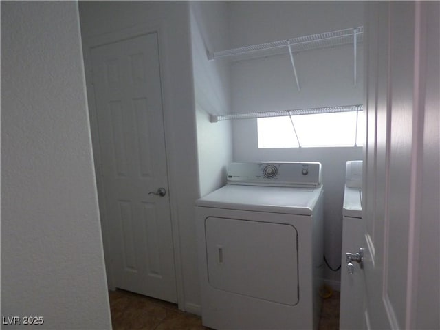 clothes washing area featuring independent washer and dryer