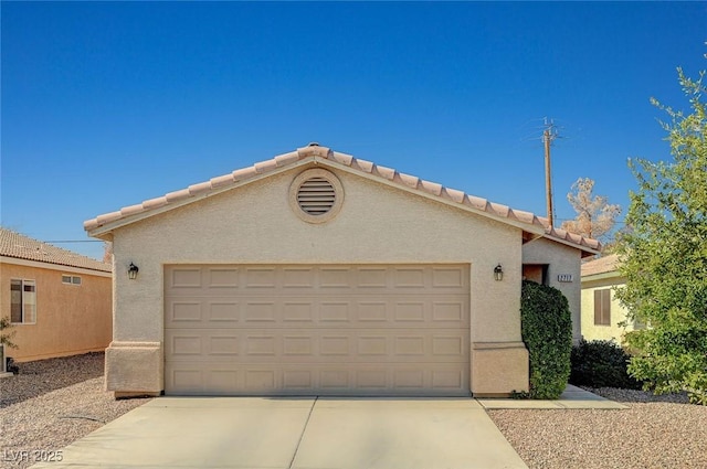 ranch-style home featuring driveway, a tile roof, and stucco siding