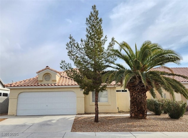 mediterranean / spanish-style house featuring a garage