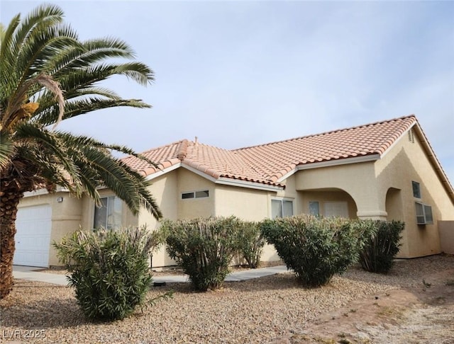 view of side of home with a garage