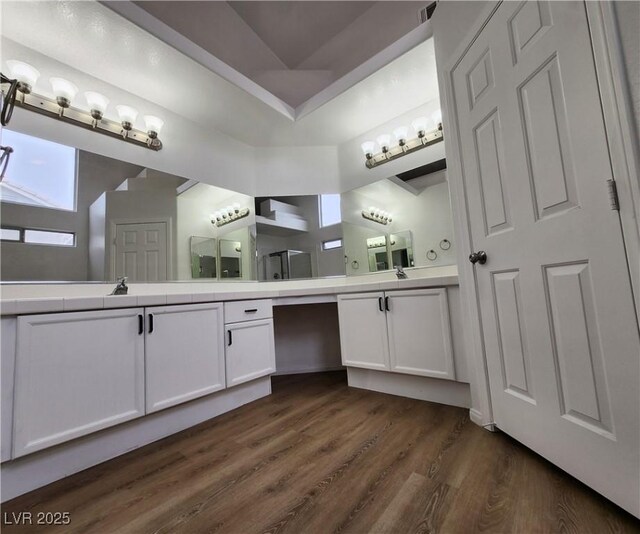 bathroom featuring vanity and hardwood / wood-style floors