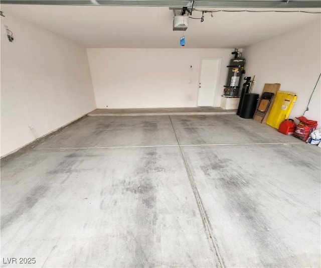 garage featuring a garage door opener and gas water heater