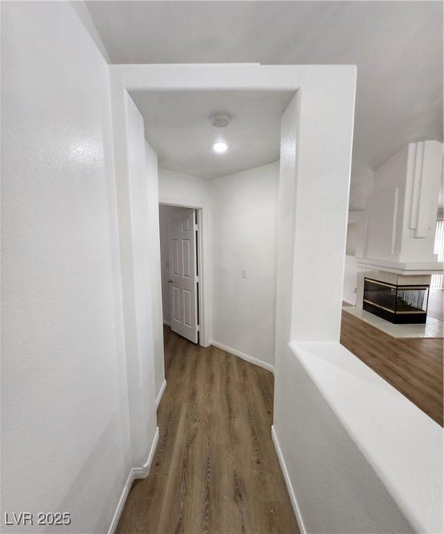 corridor featuring hardwood / wood-style floors