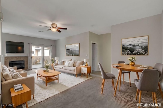 carpeted living room with ceiling fan