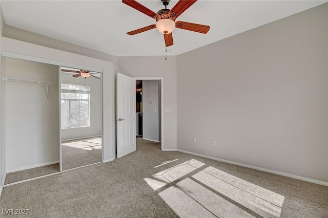 unfurnished bedroom with ceiling fan, a closet, and light carpet