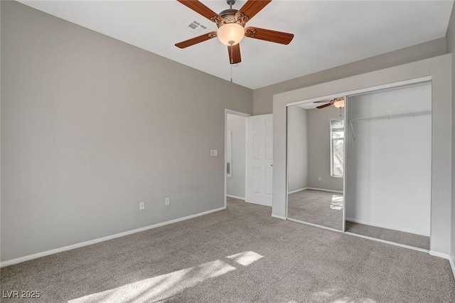 unfurnished bedroom with carpet floors, a closet, and ceiling fan