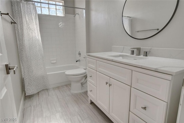 full bathroom featuring shower / bath combo, vanity, and toilet