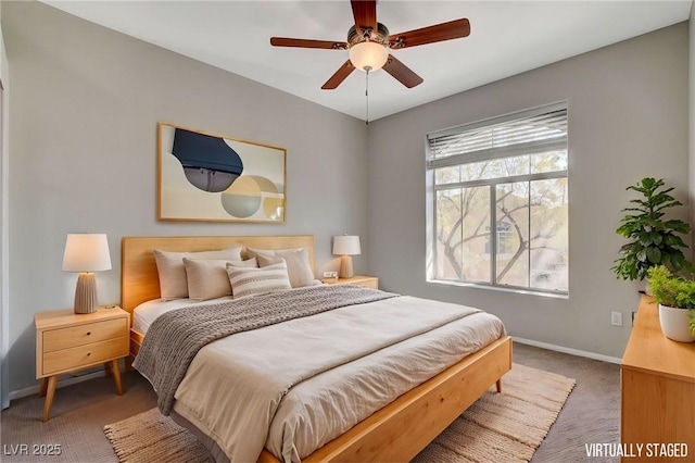 bedroom with ceiling fan and carpet floors