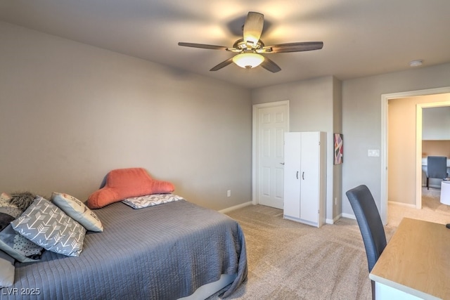 bedroom with baseboards, light carpet, and a ceiling fan