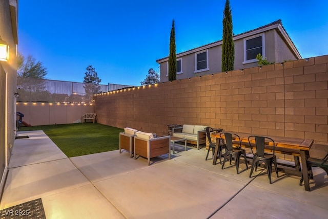 view of patio featuring an outdoor hangout area and a fenced backyard