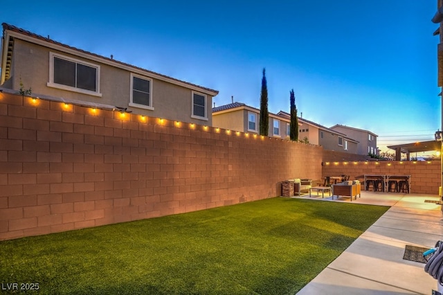 view of yard featuring a fenced backyard, outdoor lounge area, and a patio area