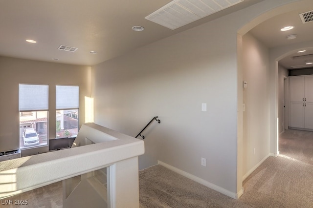 stairs with recessed lighting, visible vents, carpet floors, and baseboards