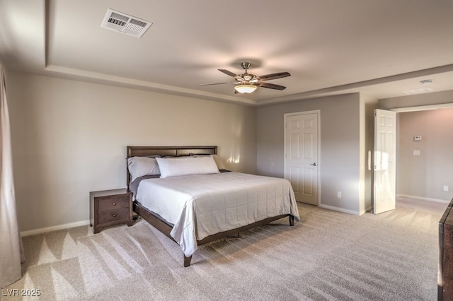 bedroom with a ceiling fan, light colored carpet, visible vents, and baseboards