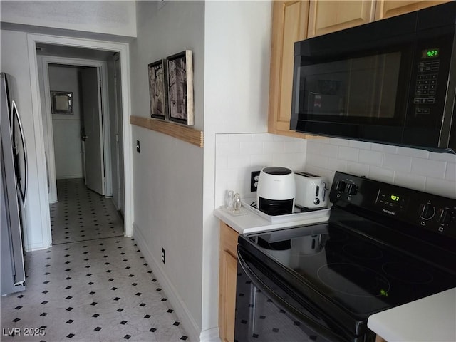 kitchen featuring decorative backsplash, light brown cabinets, and black appliances