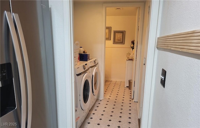 laundry area featuring washing machine and clothes dryer