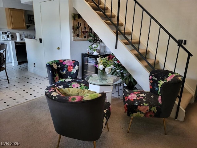 dining space featuring light carpet