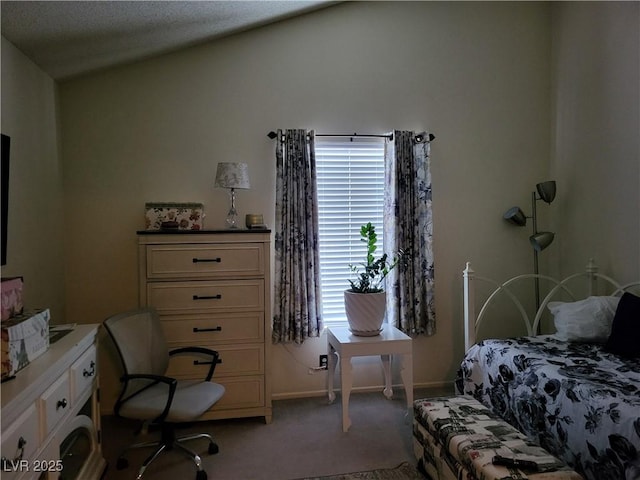 carpeted bedroom featuring lofted ceiling